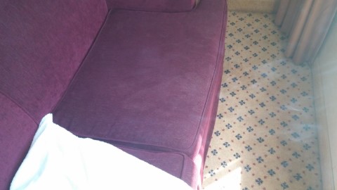 Stain on 80's couch.  Once again, looks like  someone had to pee really bad.
